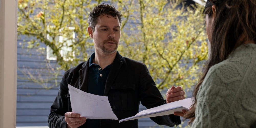 A recipient reviewing legal documents handed over by an ABC Legal process server