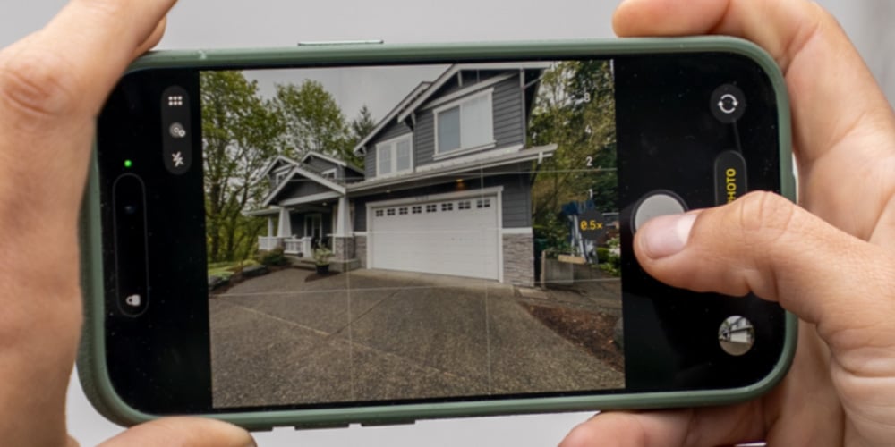 A phone screen capturing a timestamped photo of the served address