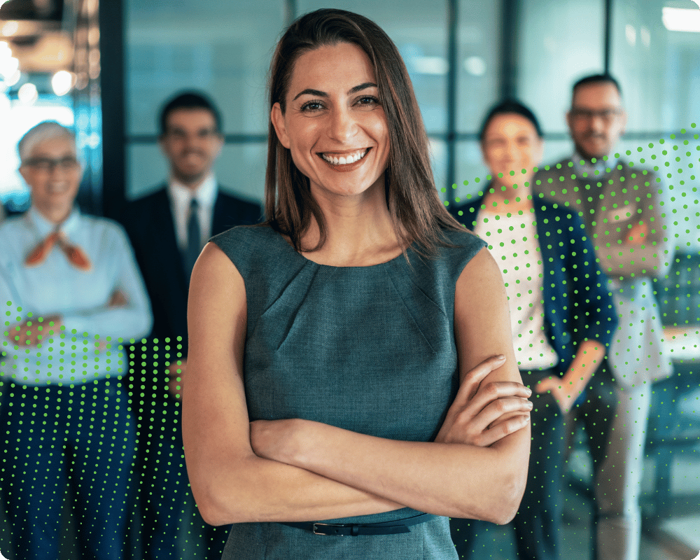 Women in front of team at office